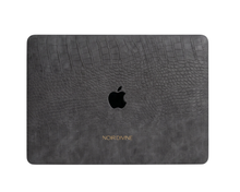 Haze vegan leather MacBook case in charcoal-black croco-embossed texture on a MacBook